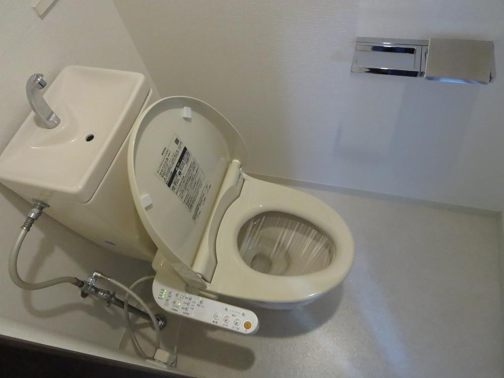 Toilet. Hot water function toilet seat
