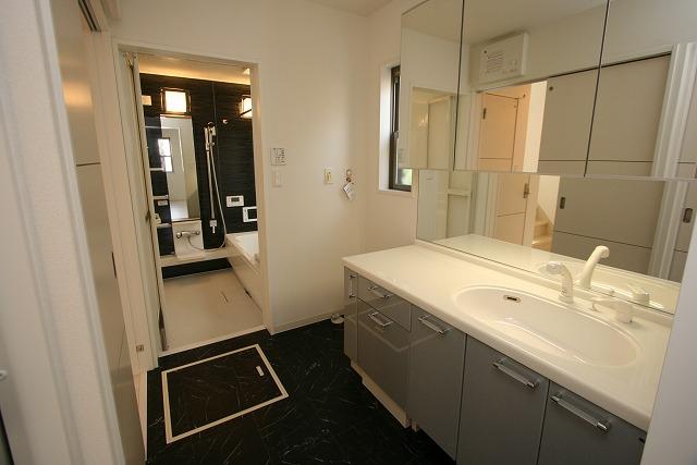 Wash basin, toilet. Spacious vanity that looks a little happy