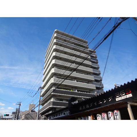 Building appearance. Large apartment towering in Kawachi Kokubu Station