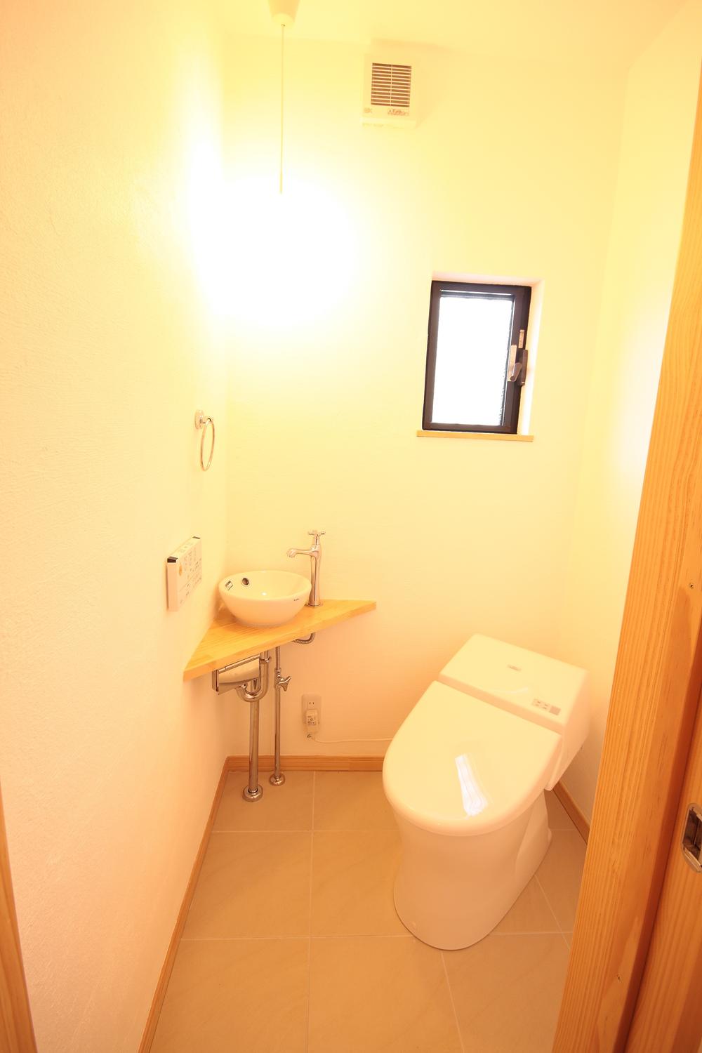 Toilet. Comfortable in the spacious toilet with hand-washing facilities
