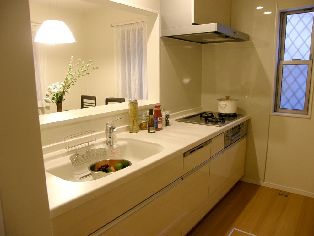 Kitchen. It is with dishwasher. Range hood and a large cupboard is also impressive!