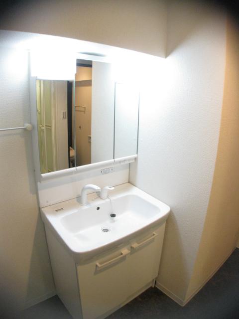 Wash basin, toilet. The left side of the washroom has a space, It will improve further usability if you put the shelf.