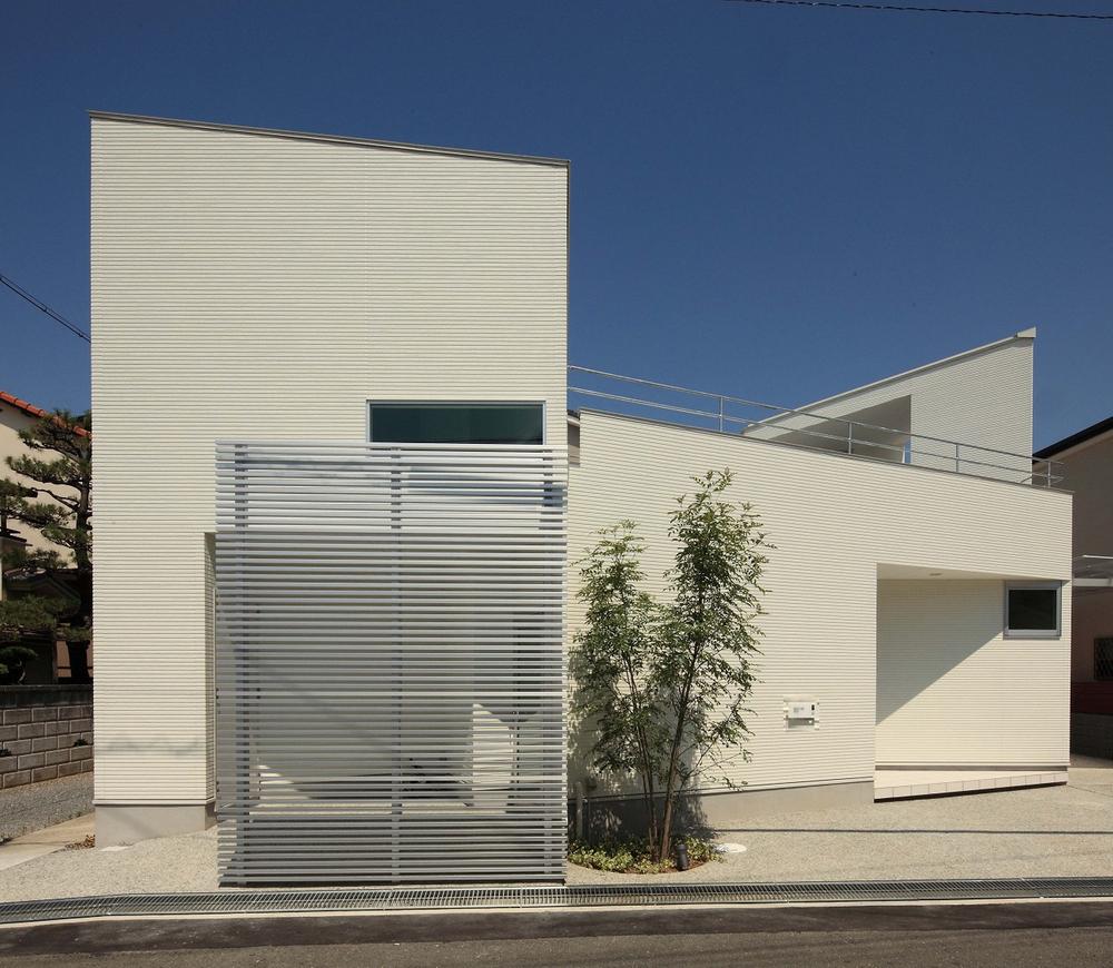 Building plan example (exterior photos). Pure white appearance to shine in blue sky
