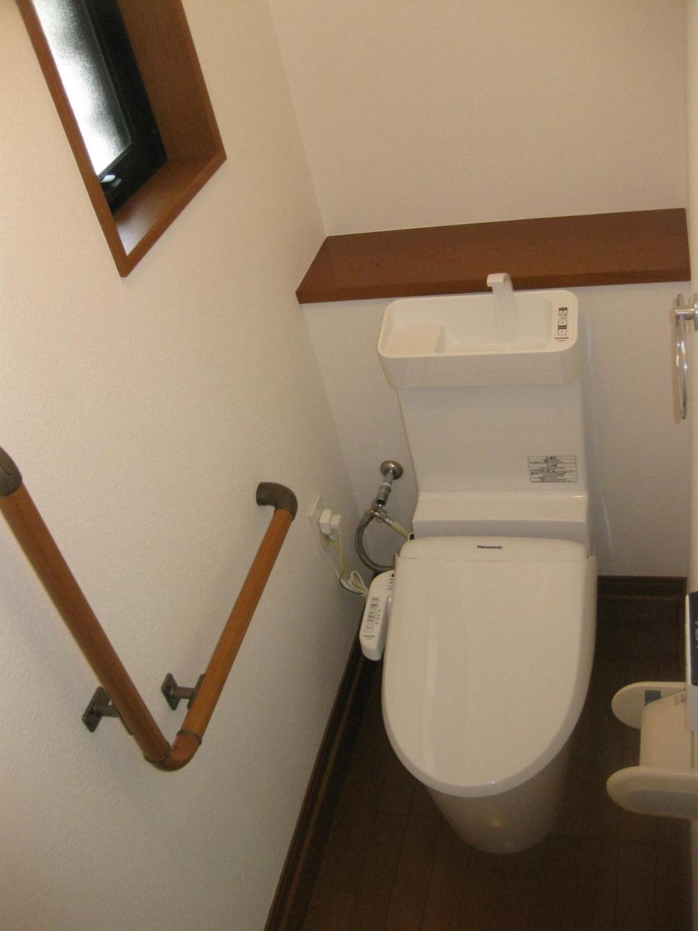 Toilet. The first floor of the toilet Panasonic Co., Ltd. 