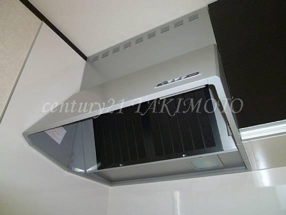 Kitchen. Steam in a large hood firmly suction