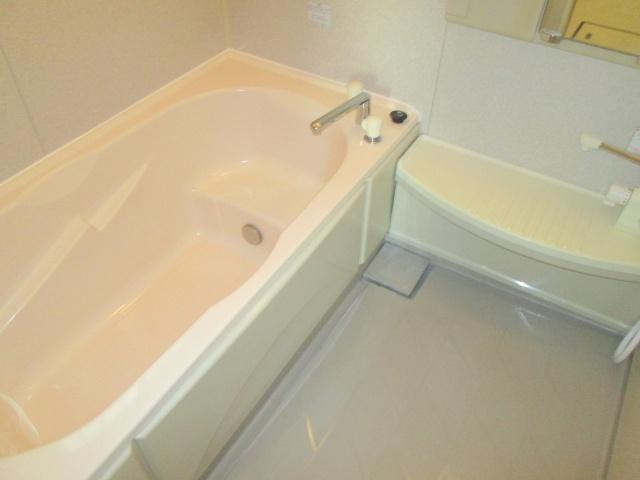 Bathroom. Wide and is a bath with a window