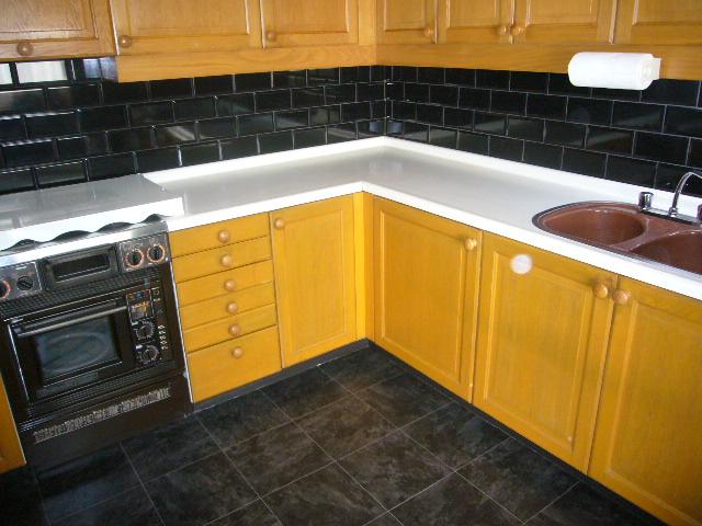 Kitchen. L-shaped spacious kitchen of
