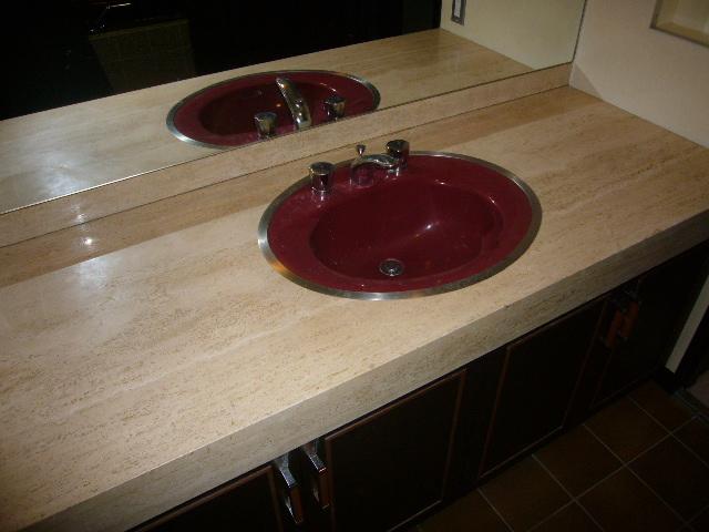 Wash basin, toilet. Vanity using natural marble