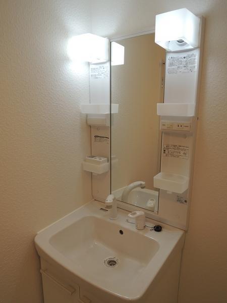 Wash basin, toilet. Shampoo dresser is also a new. Feel lighting is good cube.