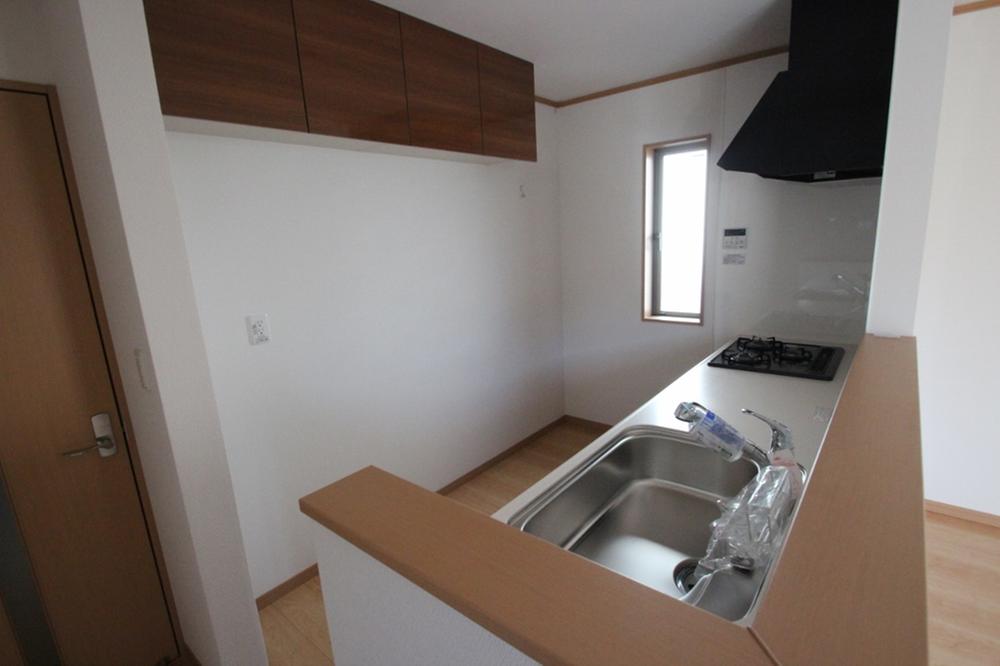 Kitchen. There is a hanging cupboard. Does not interfere with the other storage such as a favorite cupboard if this position.