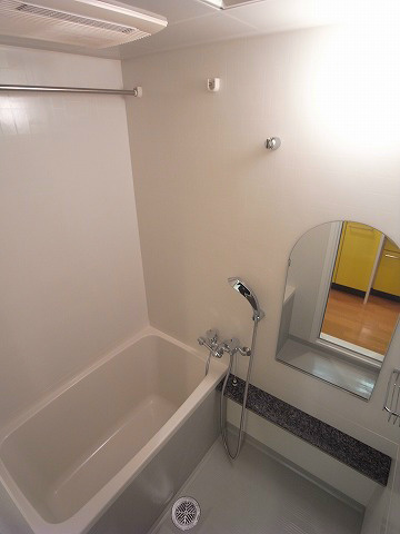 Bath. It is a bath with a bathroom dryer. 