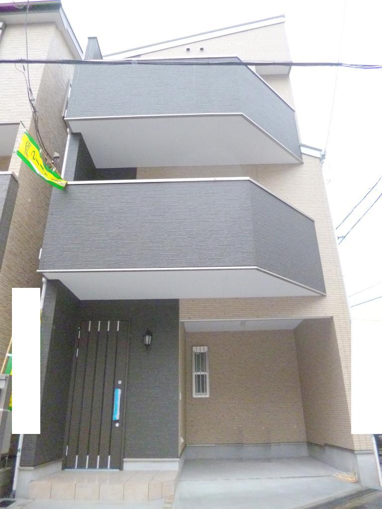 Local appearance photo. Higashinari District Kanji New construction is a three-story house