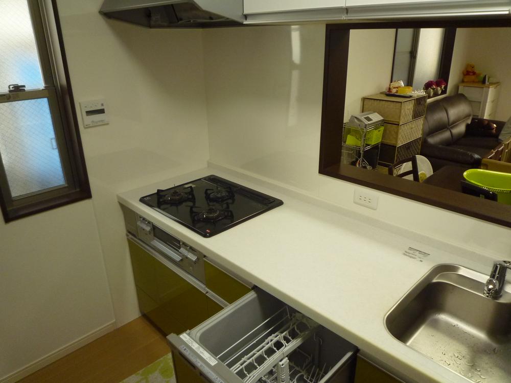 Kitchen. With dish washing and drying machine. Stove also has been carefully use. 