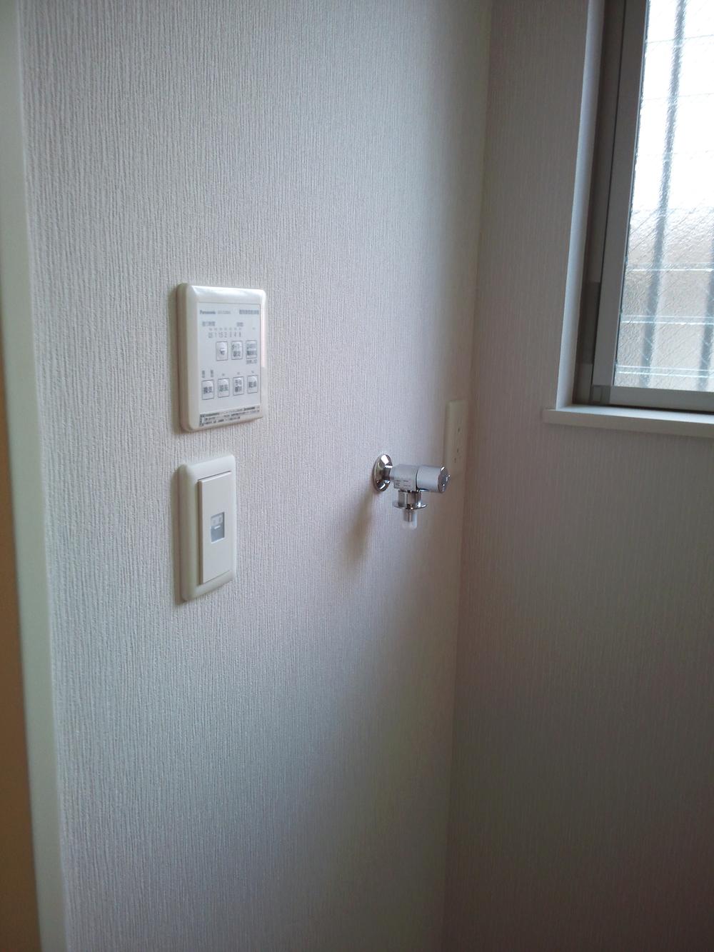 Wash basin, toilet. Laundry corner