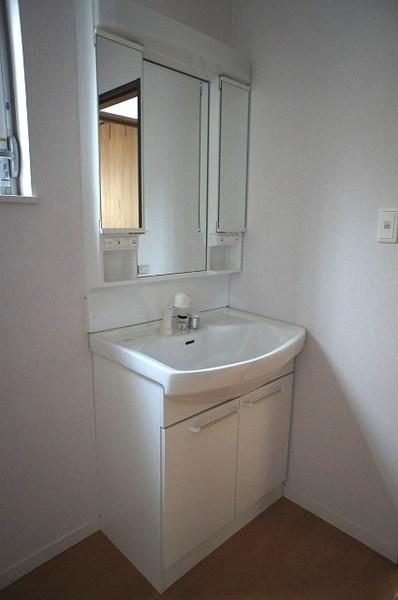 Wash basin, toilet. Dressed in smooth wash room of the room