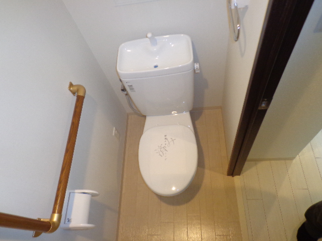 Toilet. Interior image is a photo