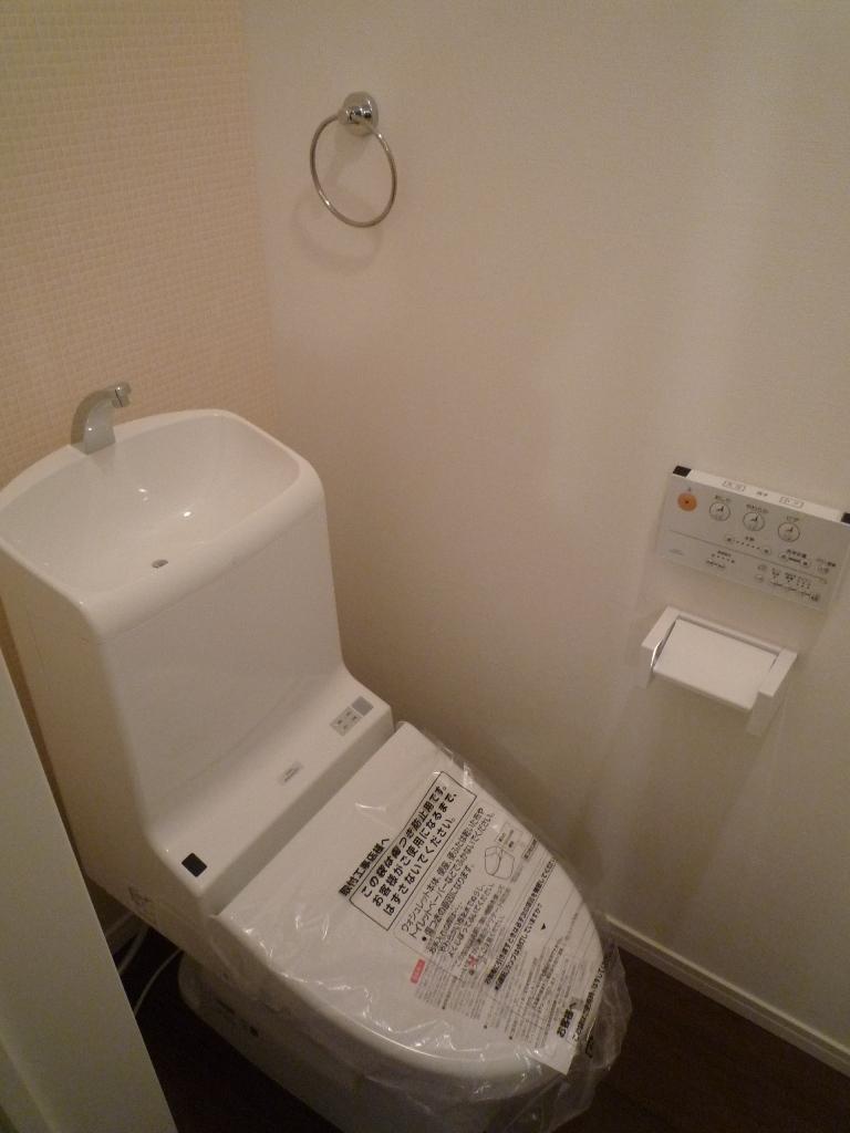 Toilet. The first floor of the toilet was finish in simple and stylish. Although toilet under the stairs, Since a final part of the stairs, There is no feeling of pressure.