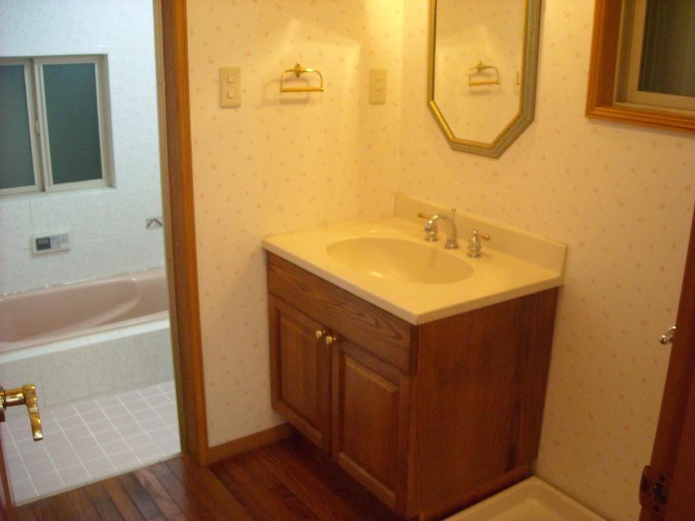 Wash basin, toilet. Spacious stylish wash room. 
