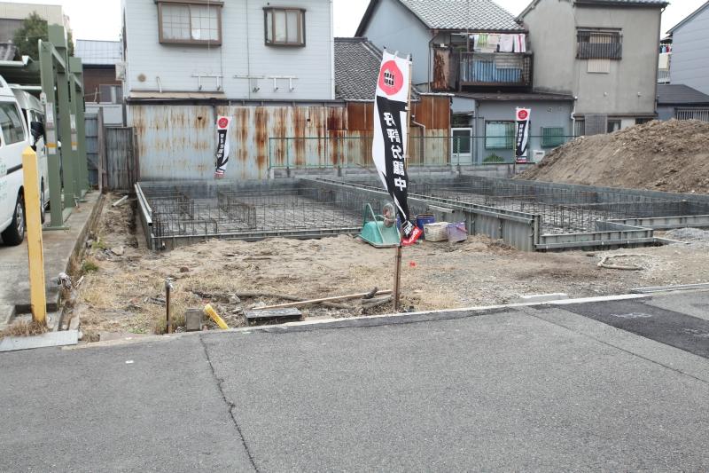 Local photos, including front road. Model house under construction