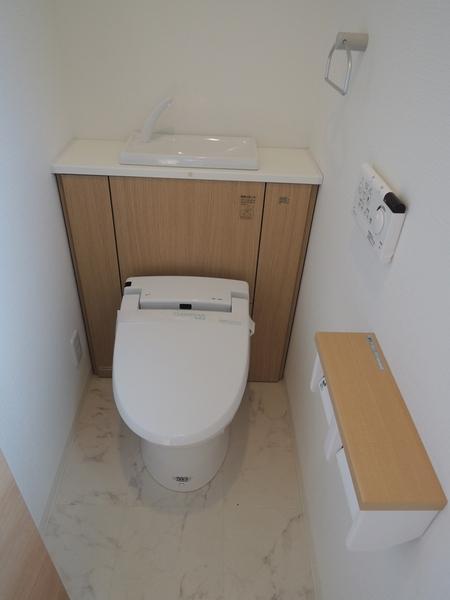 Toilet. Second floor toilet is tankless. It is also useful when cleaning because there is a hand-wash.