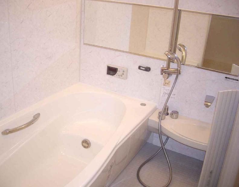 Bathroom. Tub is also entered along with the children there is a clear.  Bright bathroom
