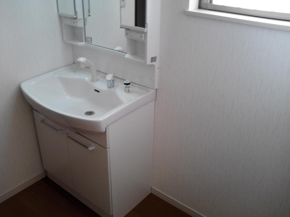 Wash basin, toilet. Wash basin is with a simple shower
