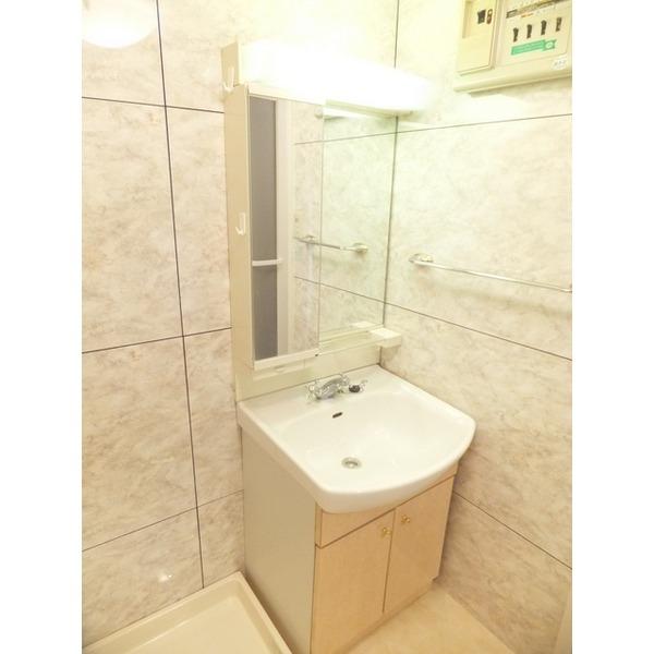 Wash basin, toilet. With a large glass