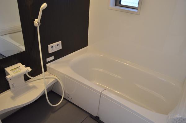 Bathroom. Happy mom relax