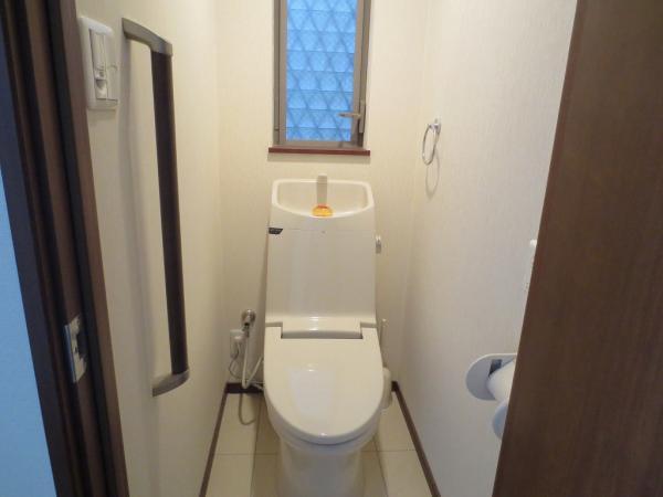 Toilet. 1st floor toilet. It is located in front of the living room. 
