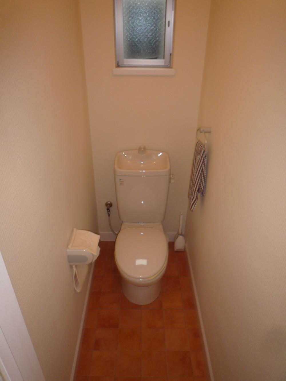Toilet. Cute tile floor! ! 
