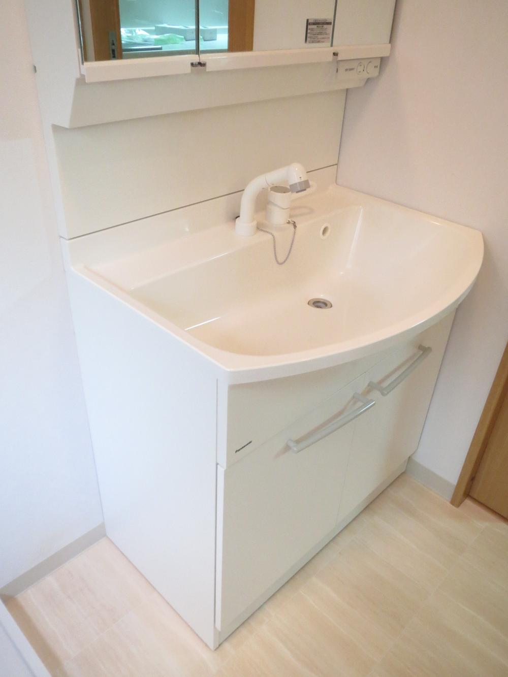 Wash basin, toilet. Vanity had made