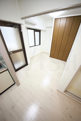 Living and room. It is using full of clean white flooring. 