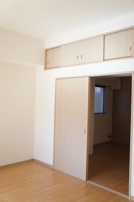 Living and room. It is with storage cupboards. 