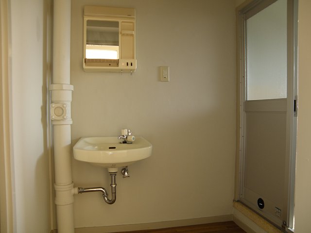 Washroom. Next to the lavatory is the Laundry Area. 