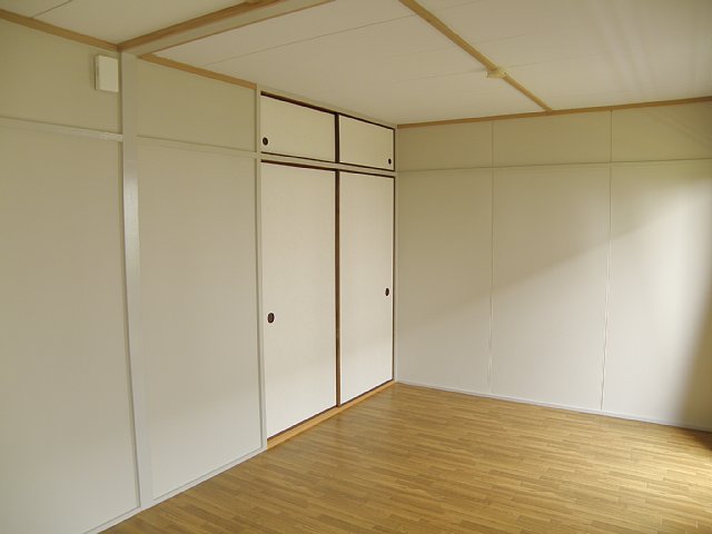 Living and room. It is housed with a convenient upper closet for storage of seasonal. 