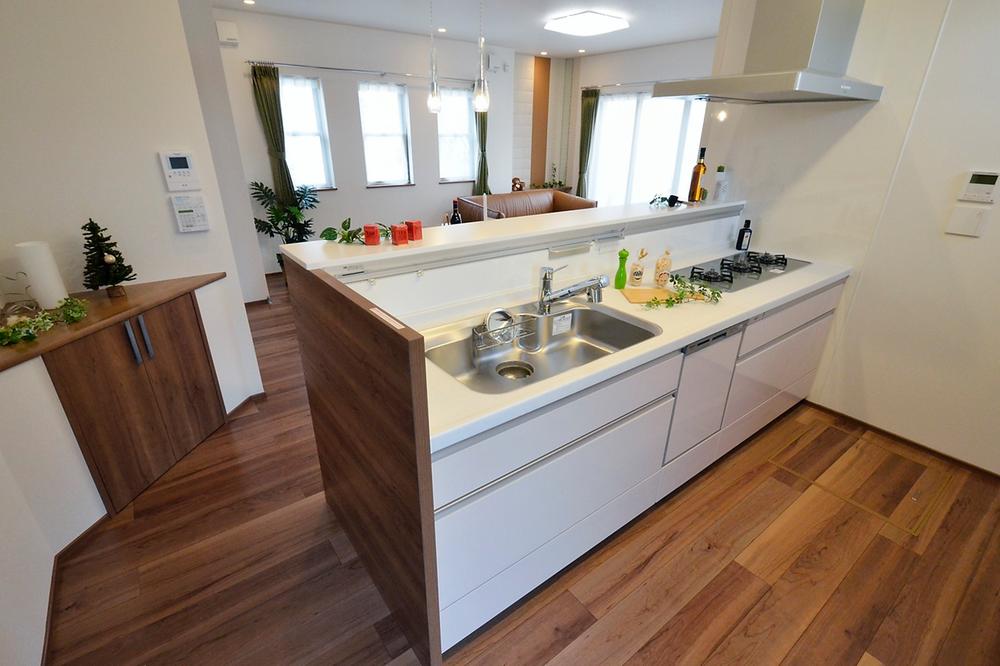 Kitchen. There is no hanging cupboard, Bright kitchen top and refreshing. If spacious and functional this kitchen, It is going to be fun to cook. (Local model house)