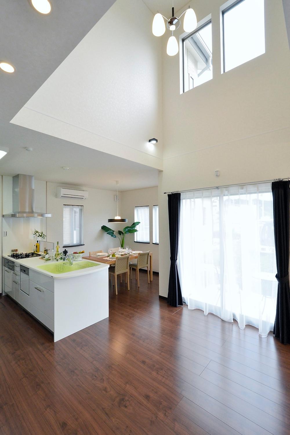 Living. Open living is bright sunlight coming through large windows and atrium. (Model house)