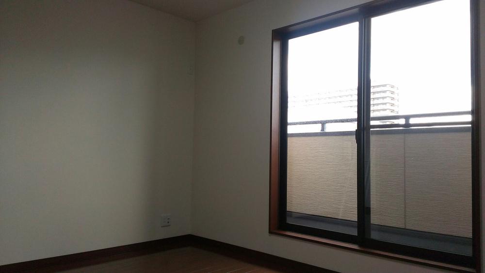 Non-living room. This room is bathed in sunlight there is a big window.