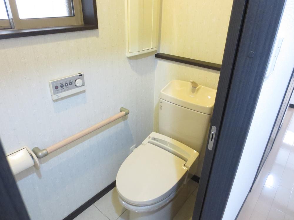 Toilet. The first floor of the next to be handrail with toilet of Japanese-style