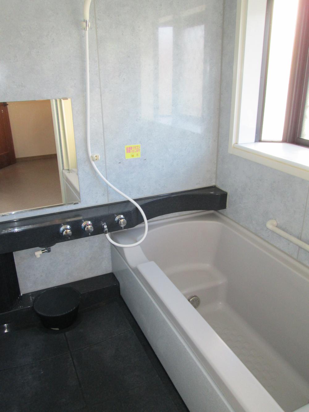 Bathroom. Guests can relax in the spacious bathroom with a window.