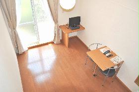 Living and room. There is also a foldable table and chairs