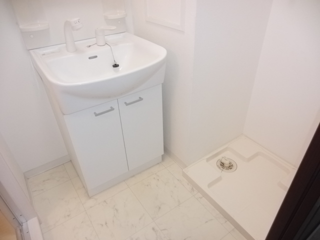 Washroom. There undressing space! Wash basin is of course shampoo dresser