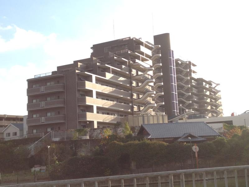 Local appearance photo. Apartment towering on a hill