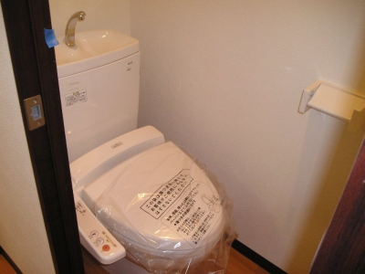 Toilet. Washlet is equipped. There is also storage rack.