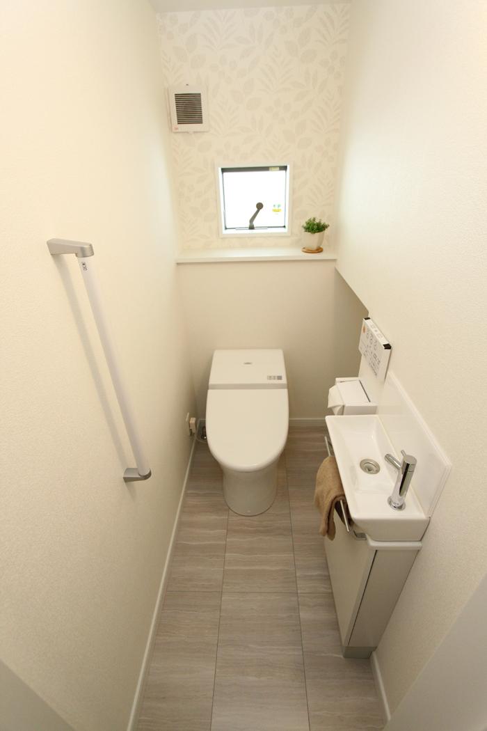 Toilet. It is decorated in white, It is simple and clean finish.