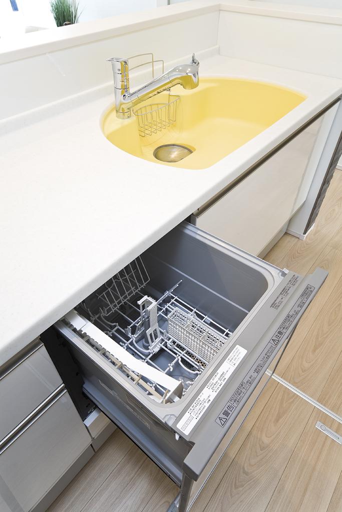 Kitchen. Stylish system Kitchen pastel yellow sink. Dishwasher'm glad function also efficient in economic (model house)