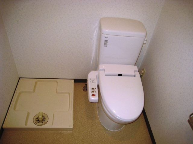Toilet. ● toilet and an indoor laundry bread ●