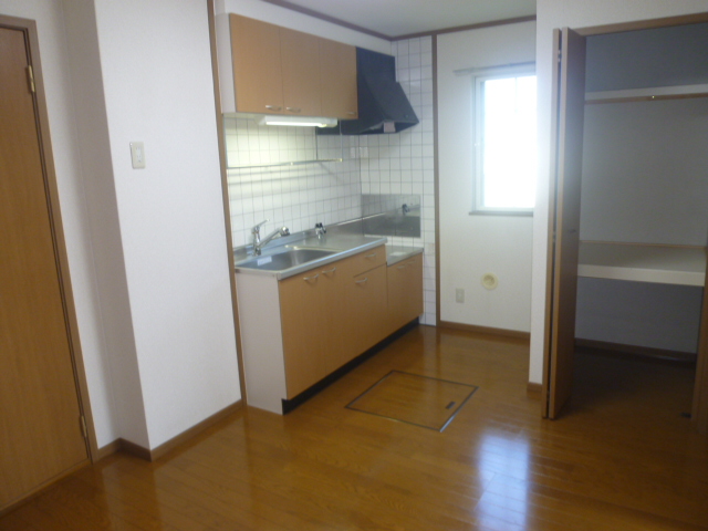 Living and room. The kitchen also has under-floor storage