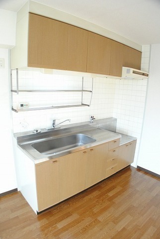 Kitchen. It is the same type of L-shaped kitchen