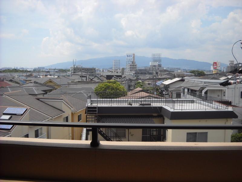 View photos from the dwelling unit. Is the view from the living room side balcony